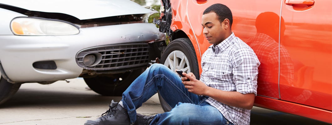 man contacting his insurance after accident