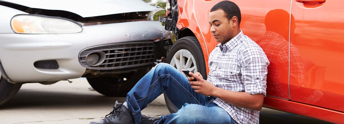man contacting his insurance after accident