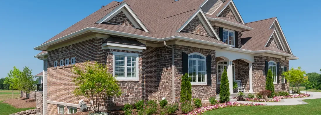 Stone and Brick Suburban House. How to Find the Best Homeowners Insurance Policy in Scarsdale, NY.