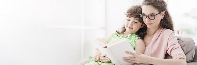 Young babysitter and child relaxing  in the living room