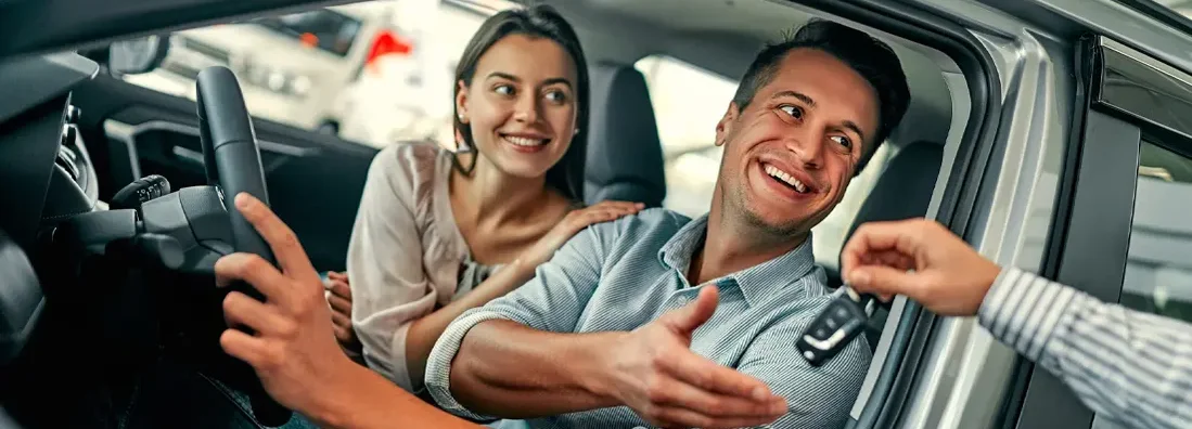 Couple bought a car in the dealership. Find New Canaan, Connecticut car insurance.