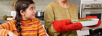 Mother and daughter cooking together