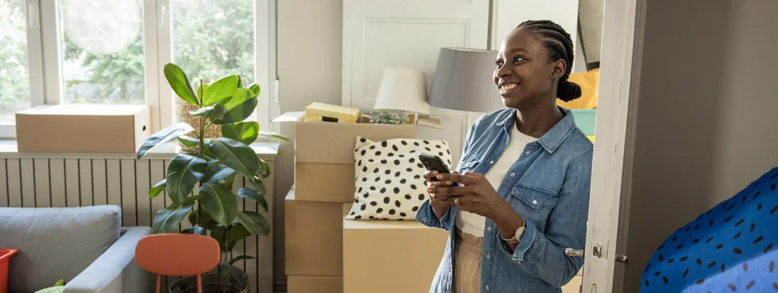 Young woman moving in new house. A Simple Guide to Buying the House You Rent.