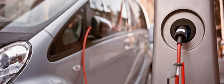 Electric car plugged in and charging.