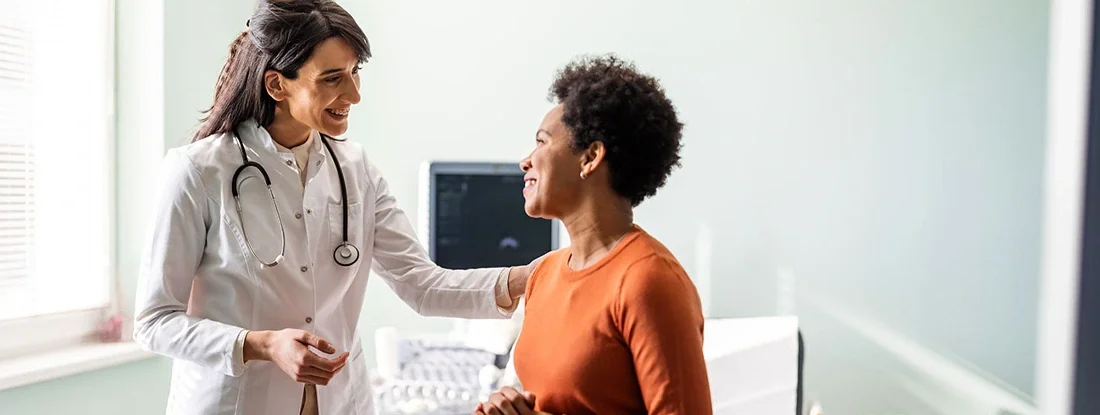 Female medical practitioner reassuring a patient. 5 Best Health Insurance Companies.