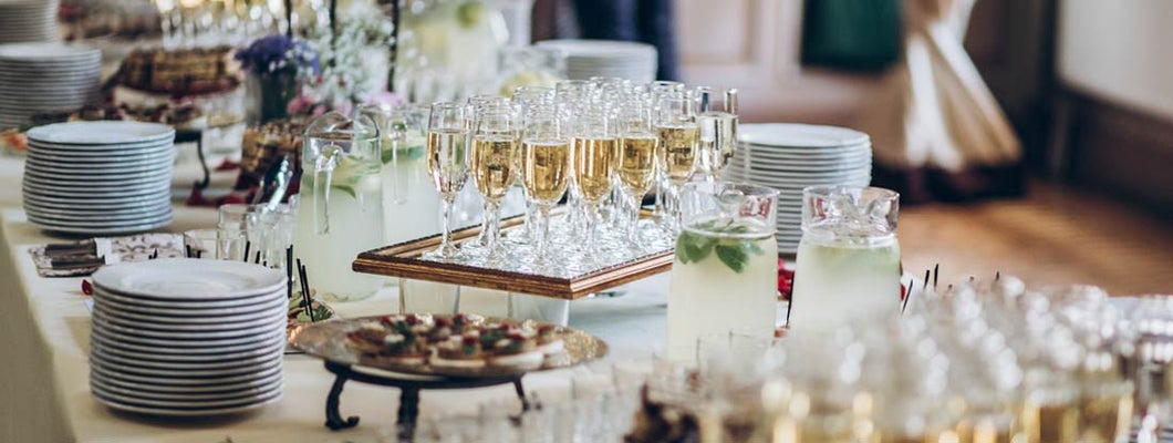 stylish champagne glasses and food appetizers set up by catering business