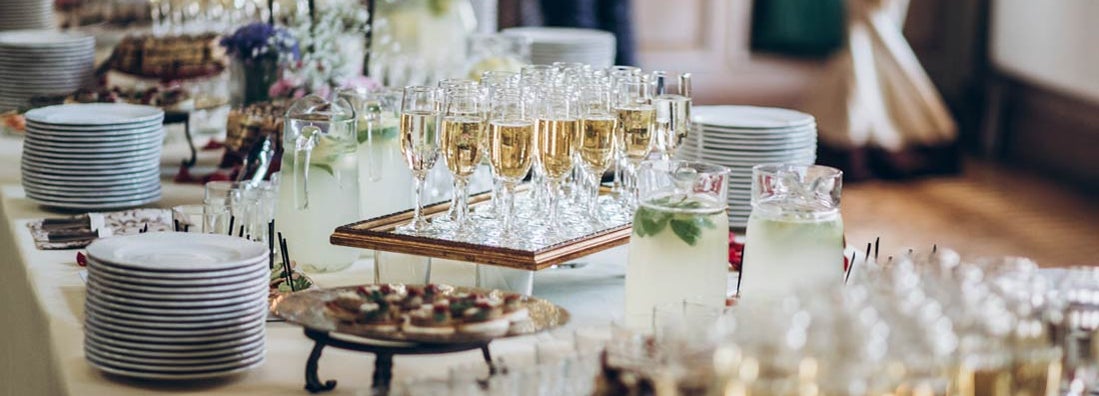 stylish champagne glasses and food appetizers set up by catering business