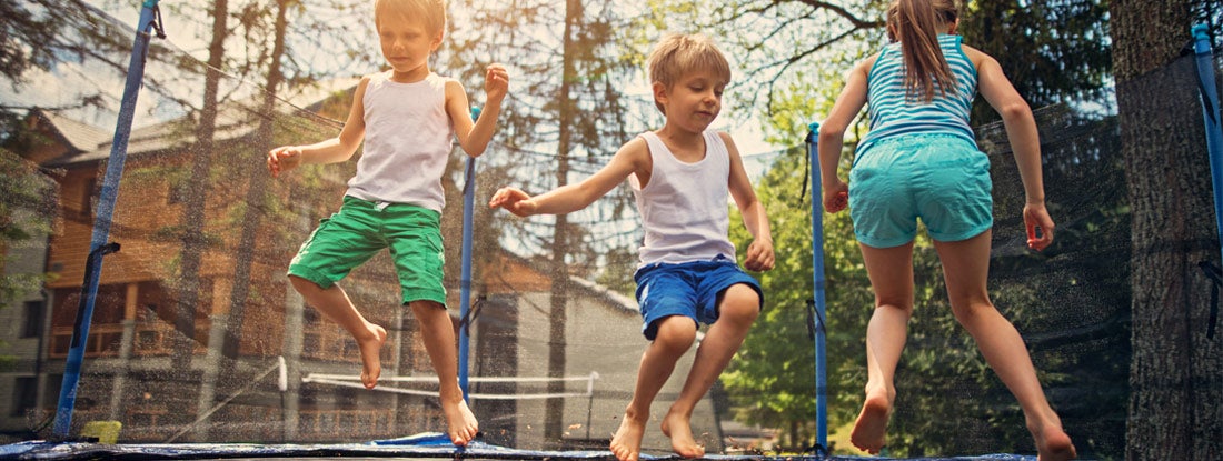 kids jumping on a trampoline