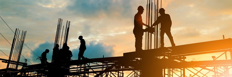 Silhouette of engineer and construction team working at site. Find builders risk insurance.