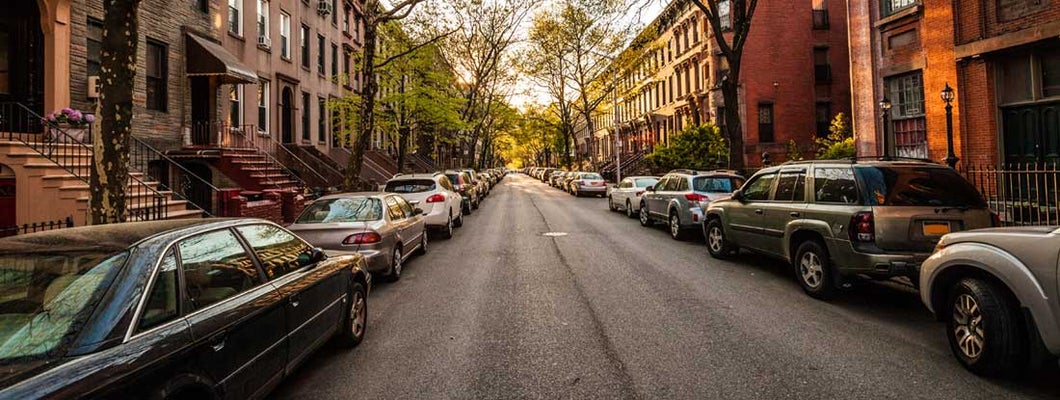 Boston brownstones on side street. Find Boston Massachusetts car insurance.