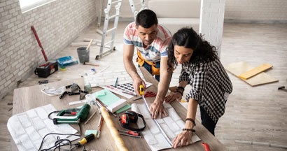 Couple making home improvement and measuring. If I Renovate My Home in Missouri, Should I Call My Insurance Agent?