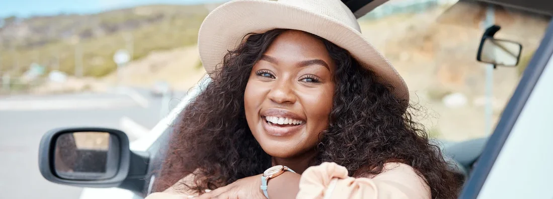 Happy face of woman in car. What Insurance is Needed for a Leased Car?