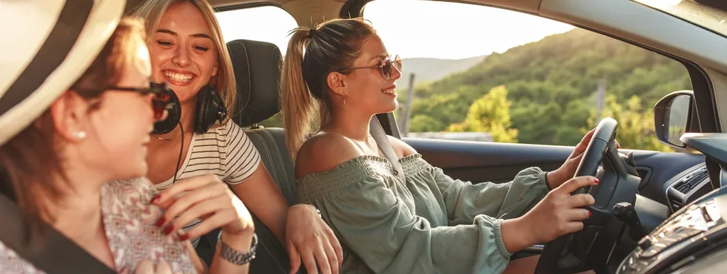 Three female friends travel together. When does insurance go down?