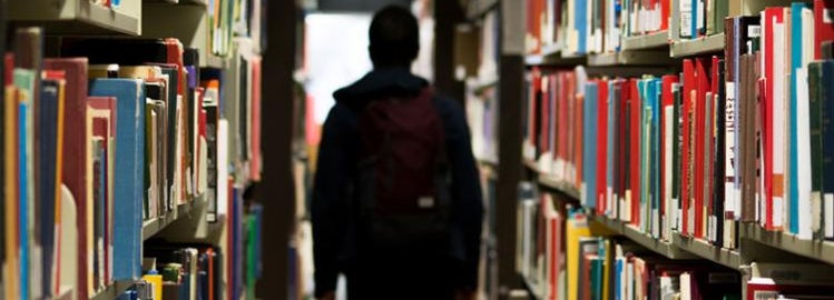 student in library