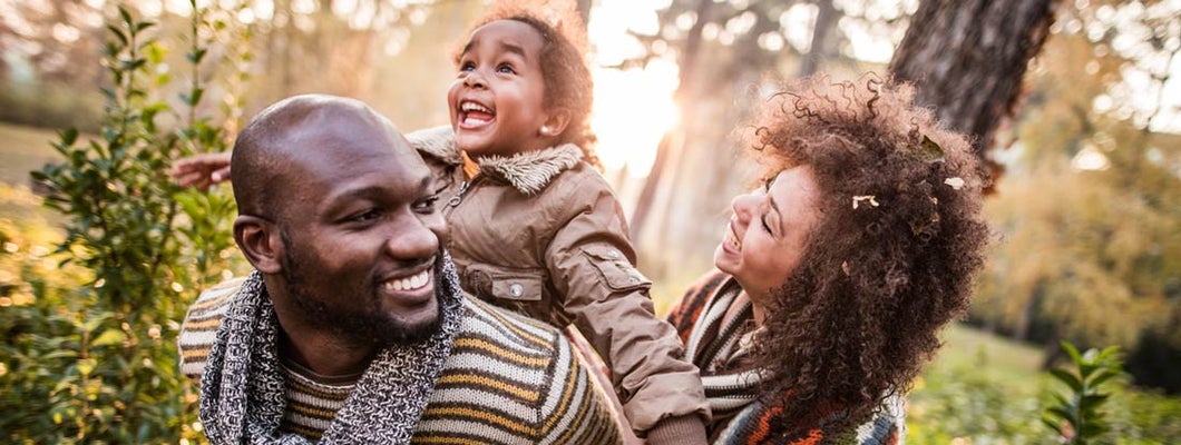 Happy parents having fun with their daughter at the park. What happens if you were denied life insurance?