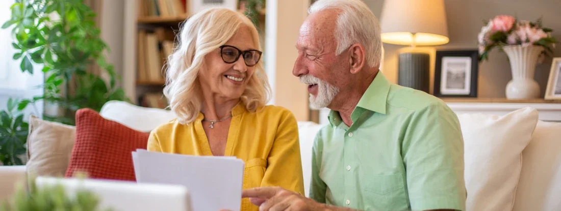 Senior couple planning retirement finances using laptop. How to Get Affordable Health Insurance Quotes.