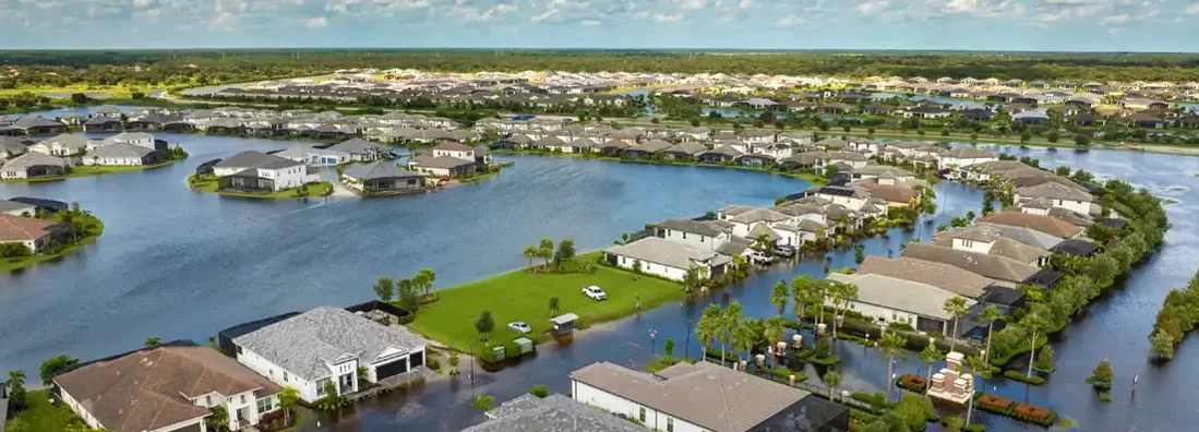 Flooded houses from Hurricane Debby rainfall water in residential community in Sarasota, Florida. Does Home Insurance Cover Hurricanes and Flood Damage?
