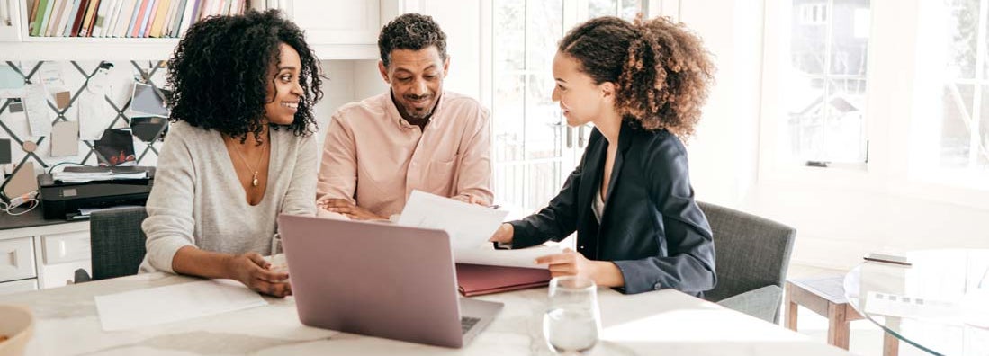 Couple speaking with their tax preparer