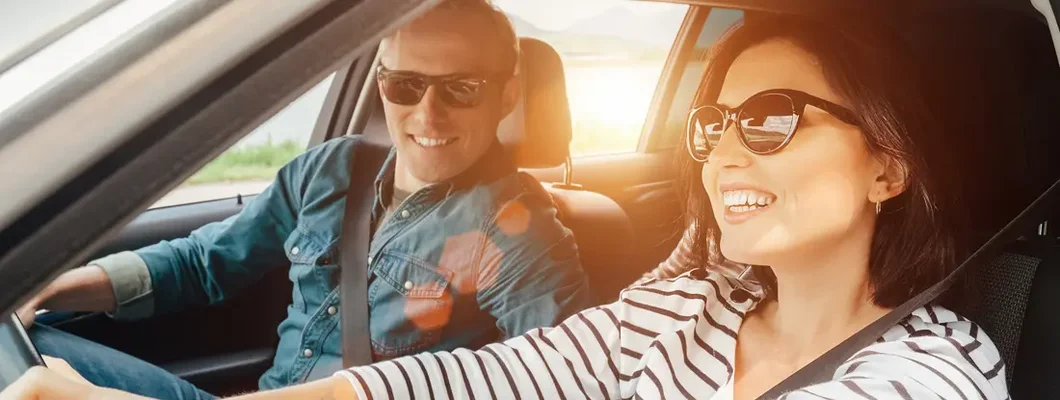 Couple driving in car. Find Palo Alto, California car insurance.