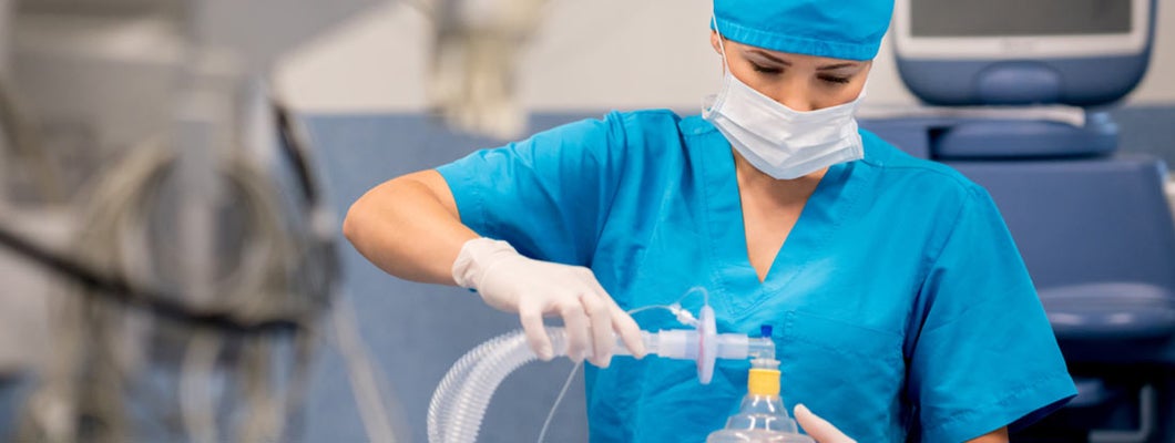 Anesthesiologist is sedating patient before surgical procedure in hospital operating room. Find anesthesiologist insurance.