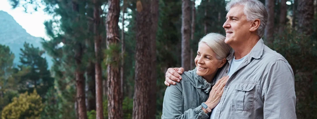 Senior couple out hiking together. Find Permanent Life Insurance.