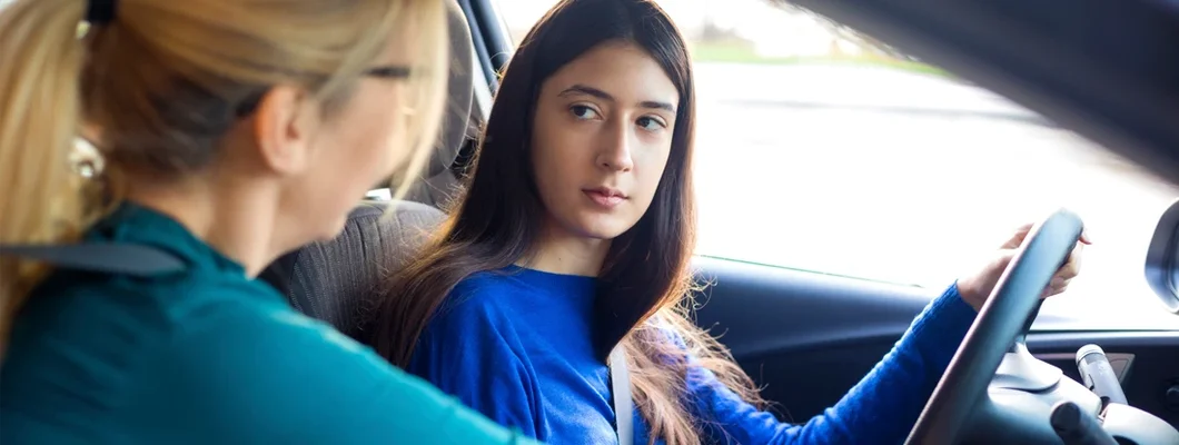 Teenager driving with her mother. Can You Get Car Insurance Without a License?