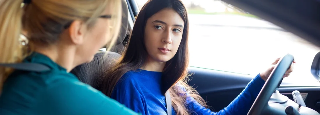 Teenager driving with her mother. Can You Get Car Insurance Without a License?