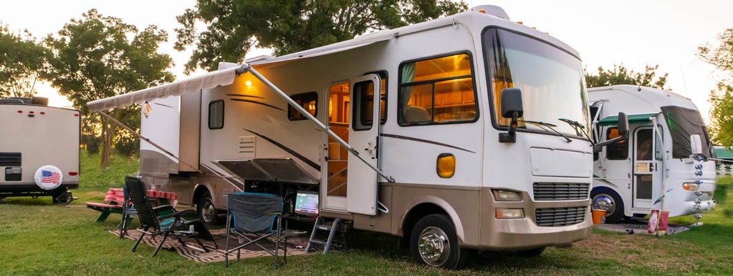 Camping at sunset at a Rv resort. Find Florida RV Insurance.