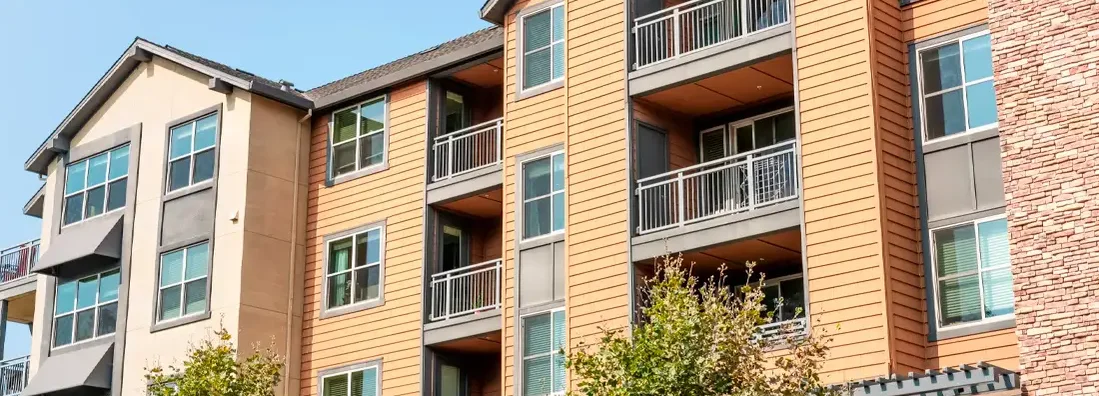 Exterior view of modern apartment building. Find Rhode Island condo insurance.