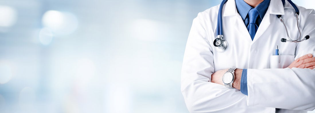 Doctor With Stethoscope In Hospital