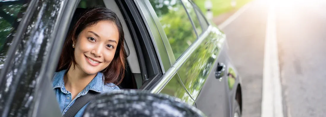 Woman driving a car on road for travel. How to Find the Best Car Insurance Policy in Simpsonville, South Carolina. 