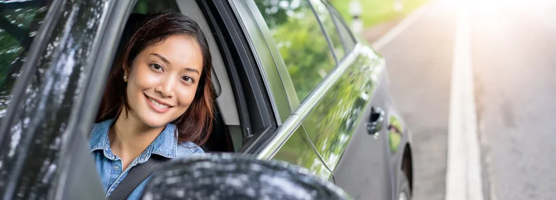 Woman driving a car on road for travel. How to Find the Best Car Insurance Policy in Simpsonville, South Carolina.