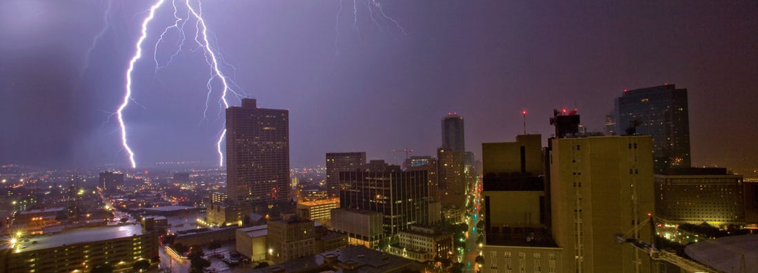 Lightning above Ft. Worth skyline. Find lightning protection company insurance.