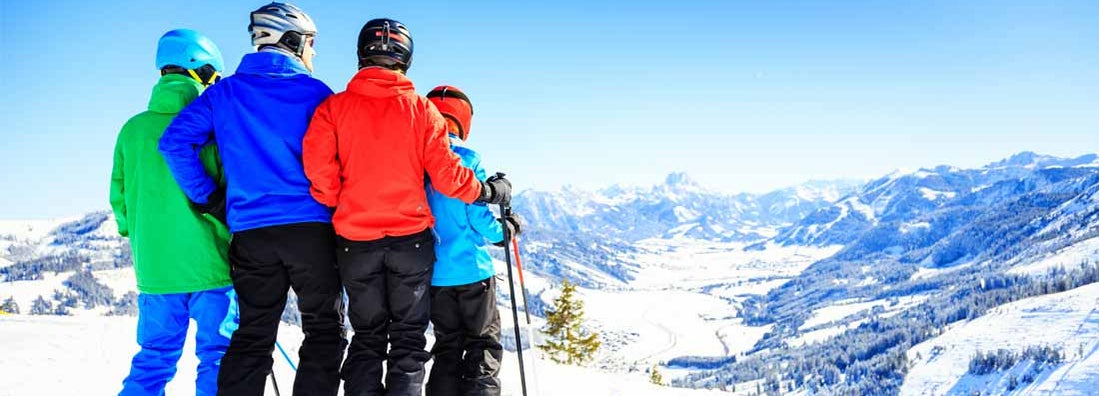 Family of four skiing in Vail