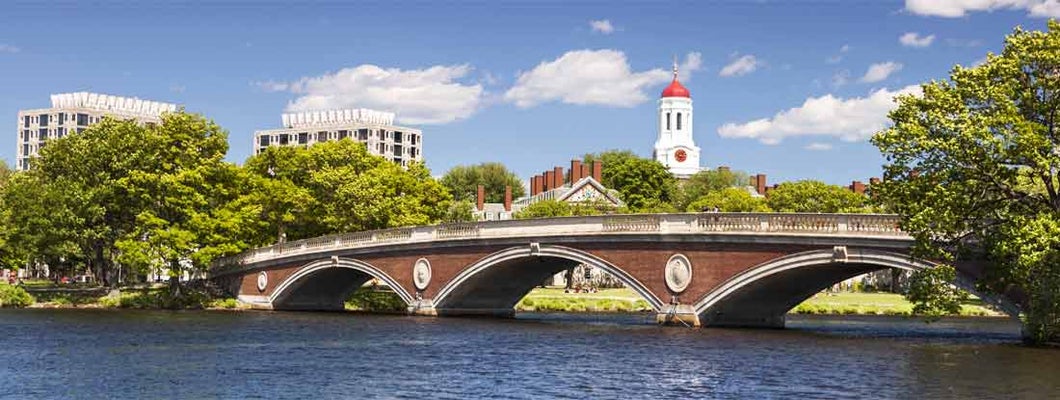 The dome of Harvard University's Dunster House and John W. Weeks Bridge over Charles River in Cambridge Massachusetts