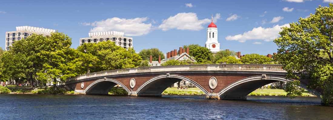 The dome of Harvard University's Dunster House and John W. Weeks Bridge over Charles River in Cambridge Massachusetts
