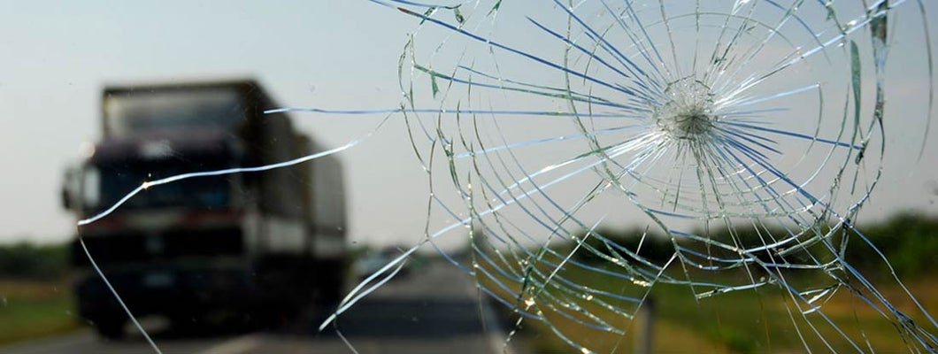 Inside of the car with windshield that was broken in car accident.  Find Comprehensive Insurance.