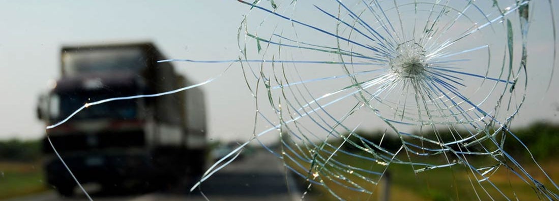 Inside of the car with windshield that was broken in car accident.  Find Comprehensive Insurance.