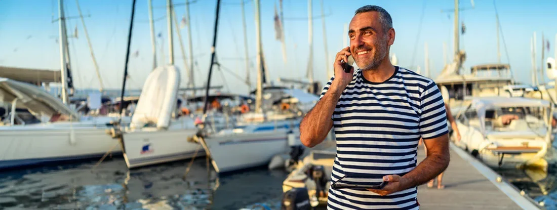 Sailboat charter owner works in a harbor. Find Charter Boat Insurance.
