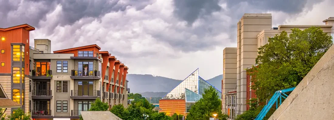 Chattanooga, Tennessee downtown walking path and cityscape at twilight. Find Tennessee Renters Insurance.