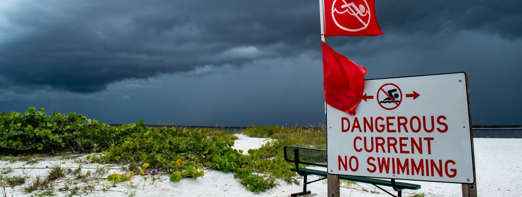 Tropical storm clouds gather off the Florida coast. Find Florida hurricane insurance.