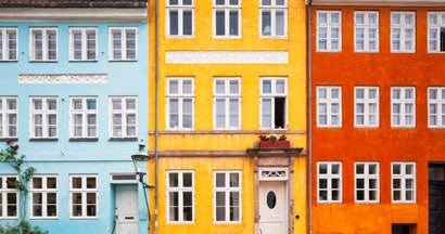 Photo of colorful townhouses in downtown. What insurance do I need to start a business? 