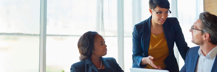 Boss and assistants having discussion in office