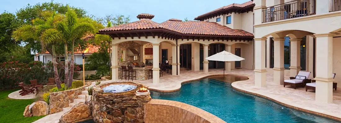 Beautiful view from an estate home overlooking a swimming pool. How to Find the Best Homeowners Insurance in Southlake, Texas.