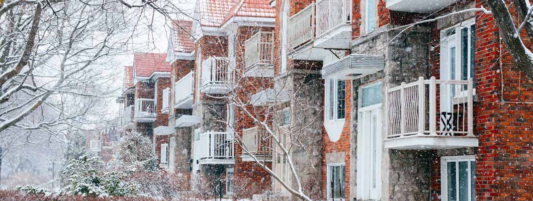 Residential Condominium Buildings on Snowy Winter Day. Find Vermont condo insurance.
