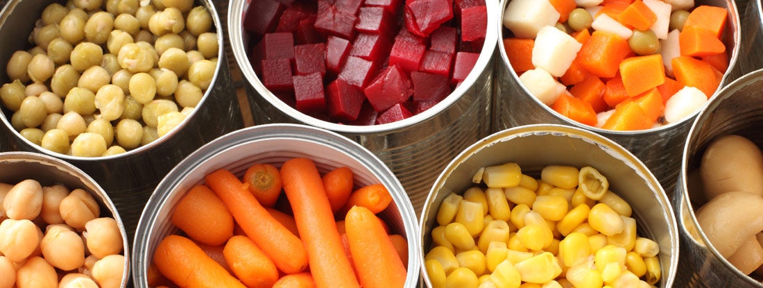 View of cans filled with vegetables
