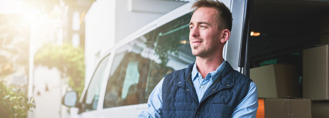 man standing outside of his van