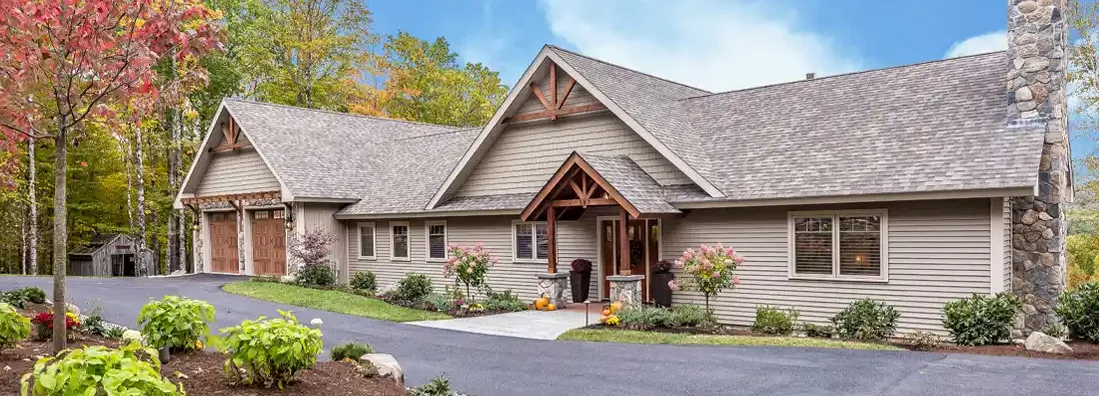 Large circular asphalt driveway in front of home. Madison, South Dakota Homeowners Insurance.