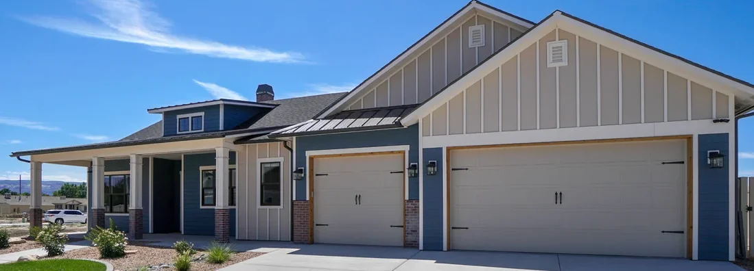 Modern Real Estate Blue and White Color Scheme with landscaping Garage View. Farmington, Utah Homeowners Insurance.