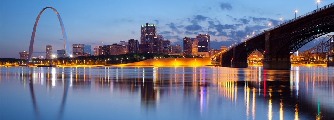 Panoramic image of St. Louis downtown with Gateway Arch at twilight